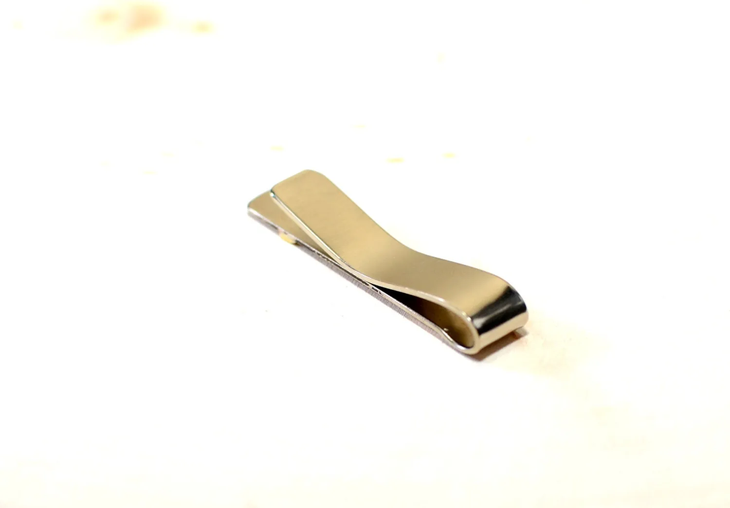 Brass arrow on sterling silver tie clip