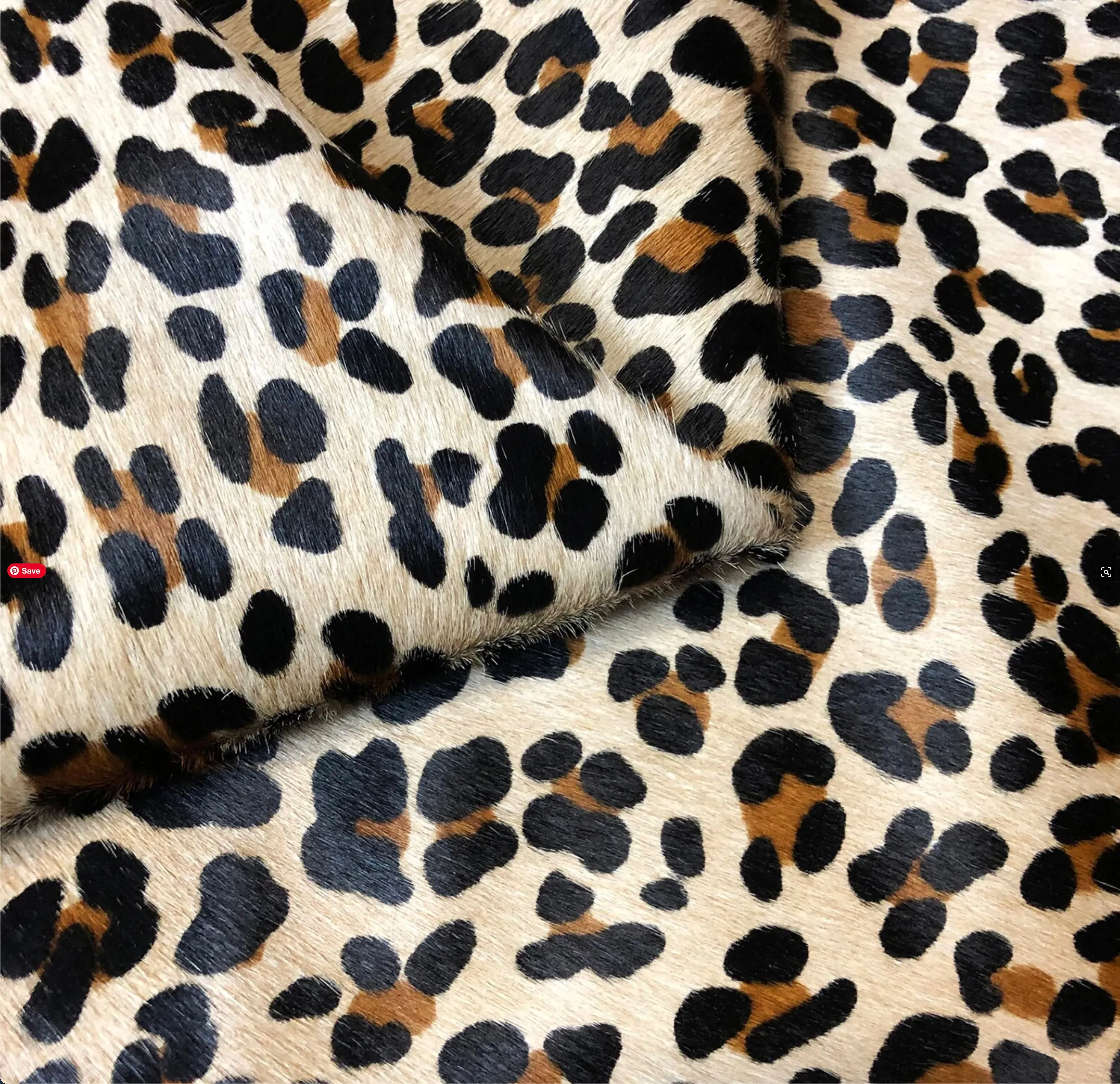 Leopard on Tan Cowhide Rug