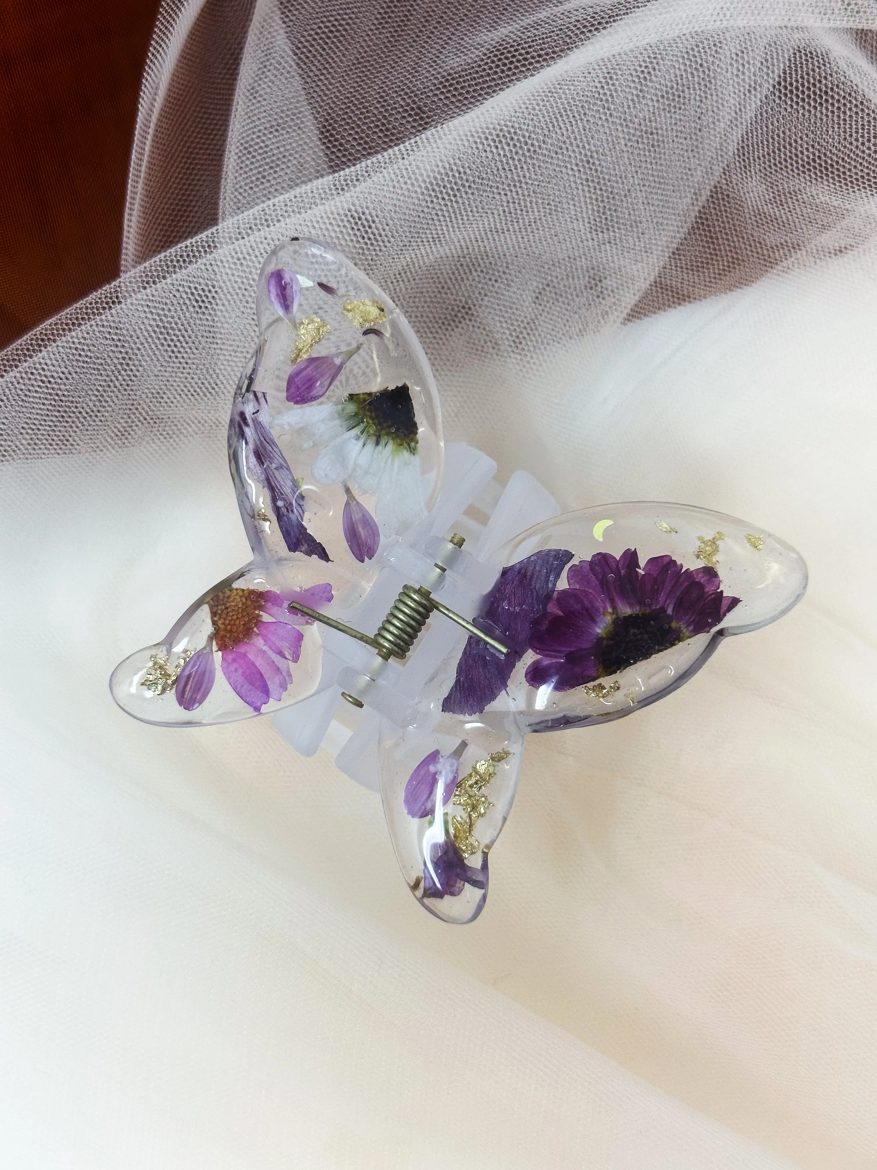 Matte Blue Butterfly Clip Infused with Real Flowers in Resin.