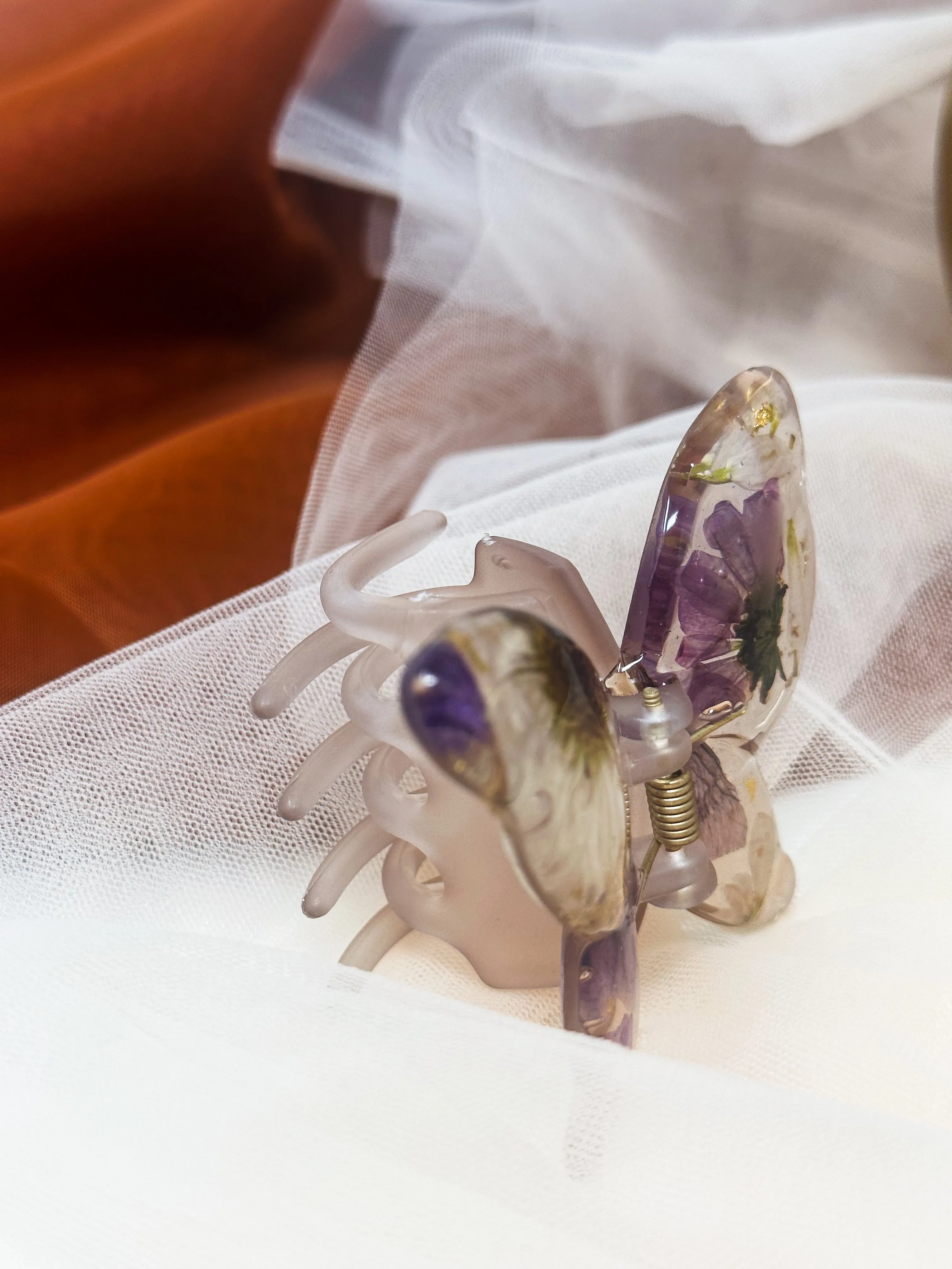 Matte Gray Butterfly Clip Infused with Real Flowers in Resin.