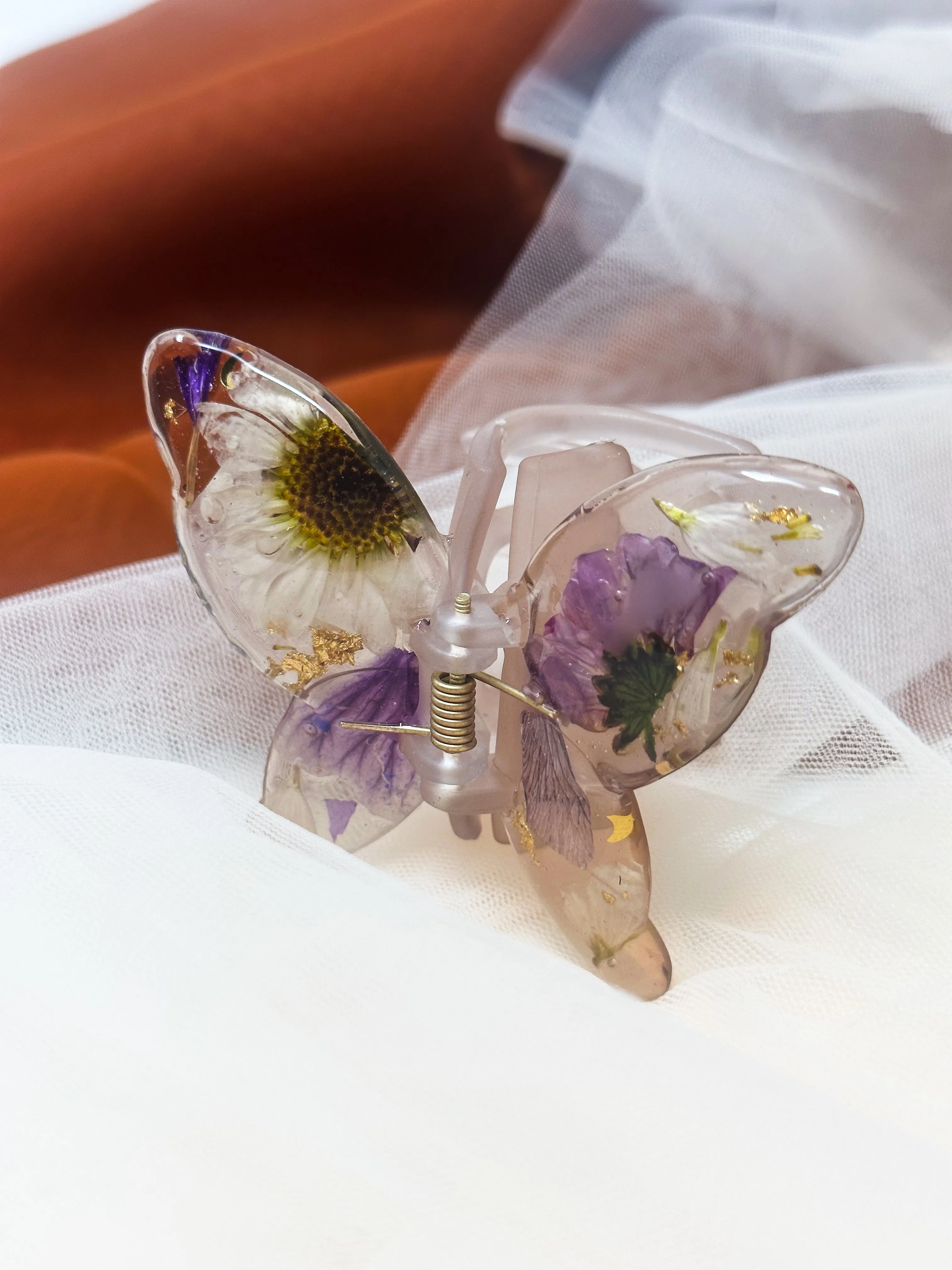 Matte Gray Butterfly Clip Infused with Real Flowers in Resin.