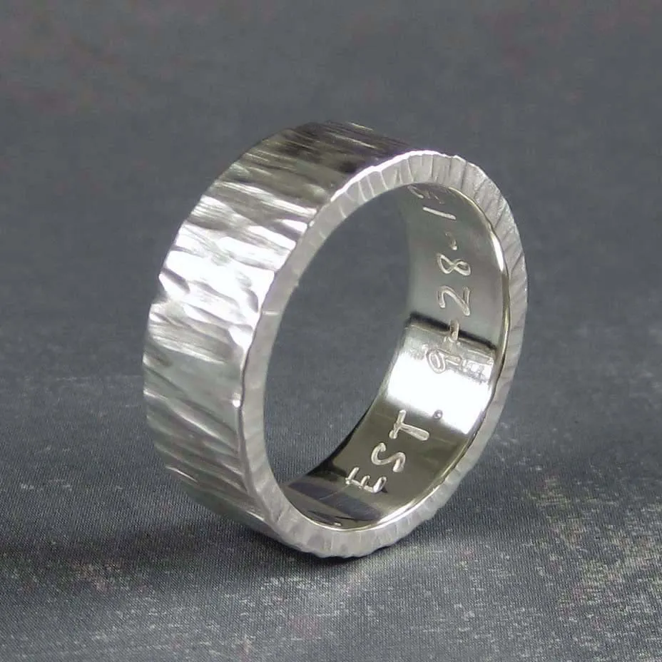 Rustic mens wedding band in carved tree bark pattern